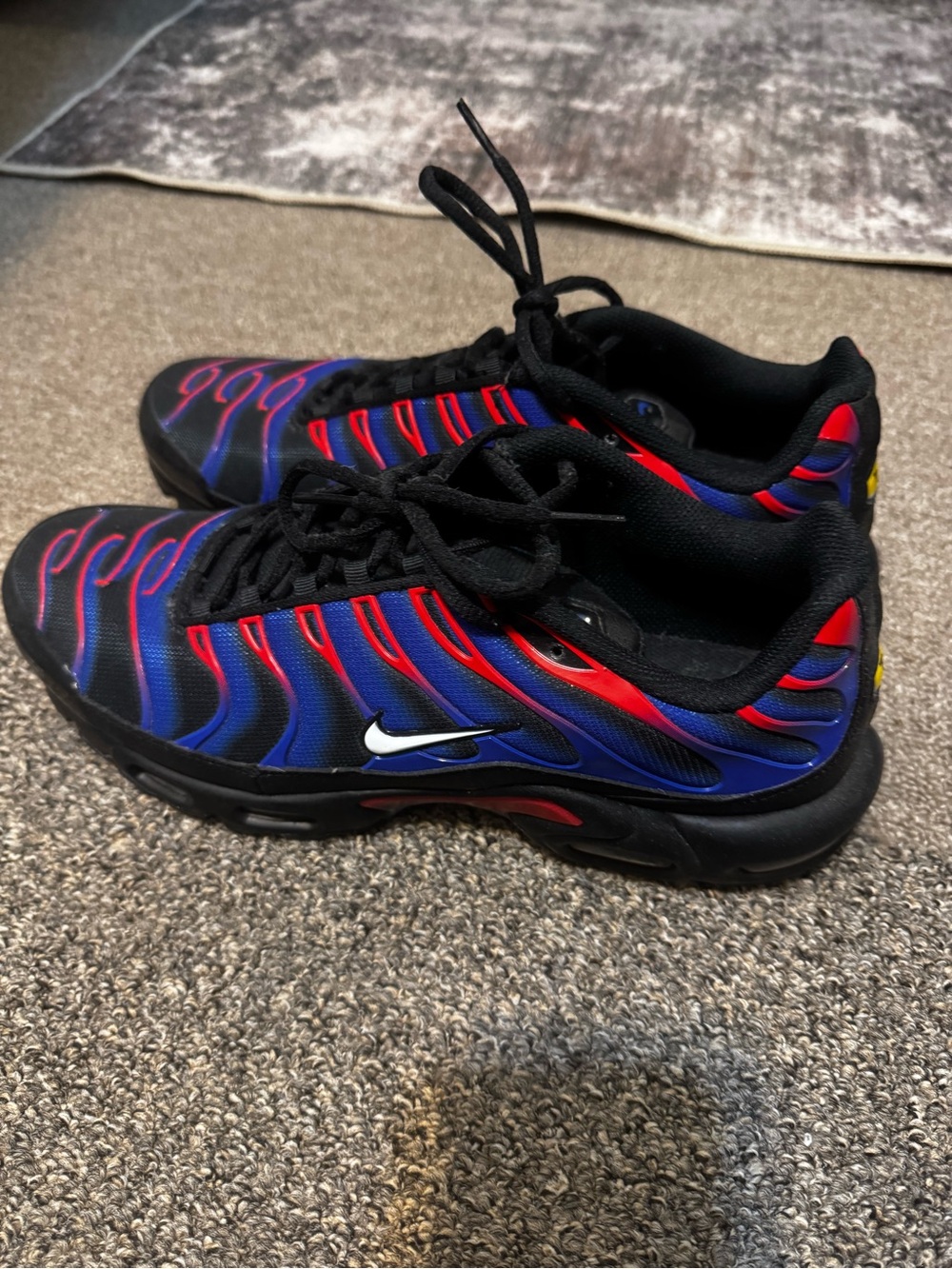 Nike Black Sneakers with Blue and Red Wave Accents